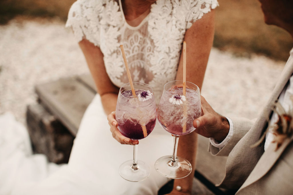 married couple enjoying cocktails for boho wedding inspiration