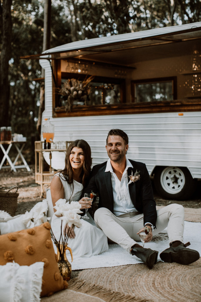 Couple relaxing in front of mobile bar at Glenrock State Conservation Area Engagement