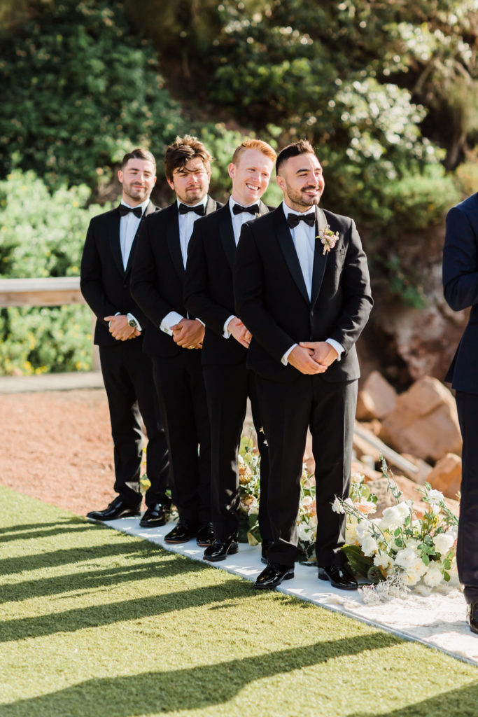 The Anchorage wedding groomsmen smiling