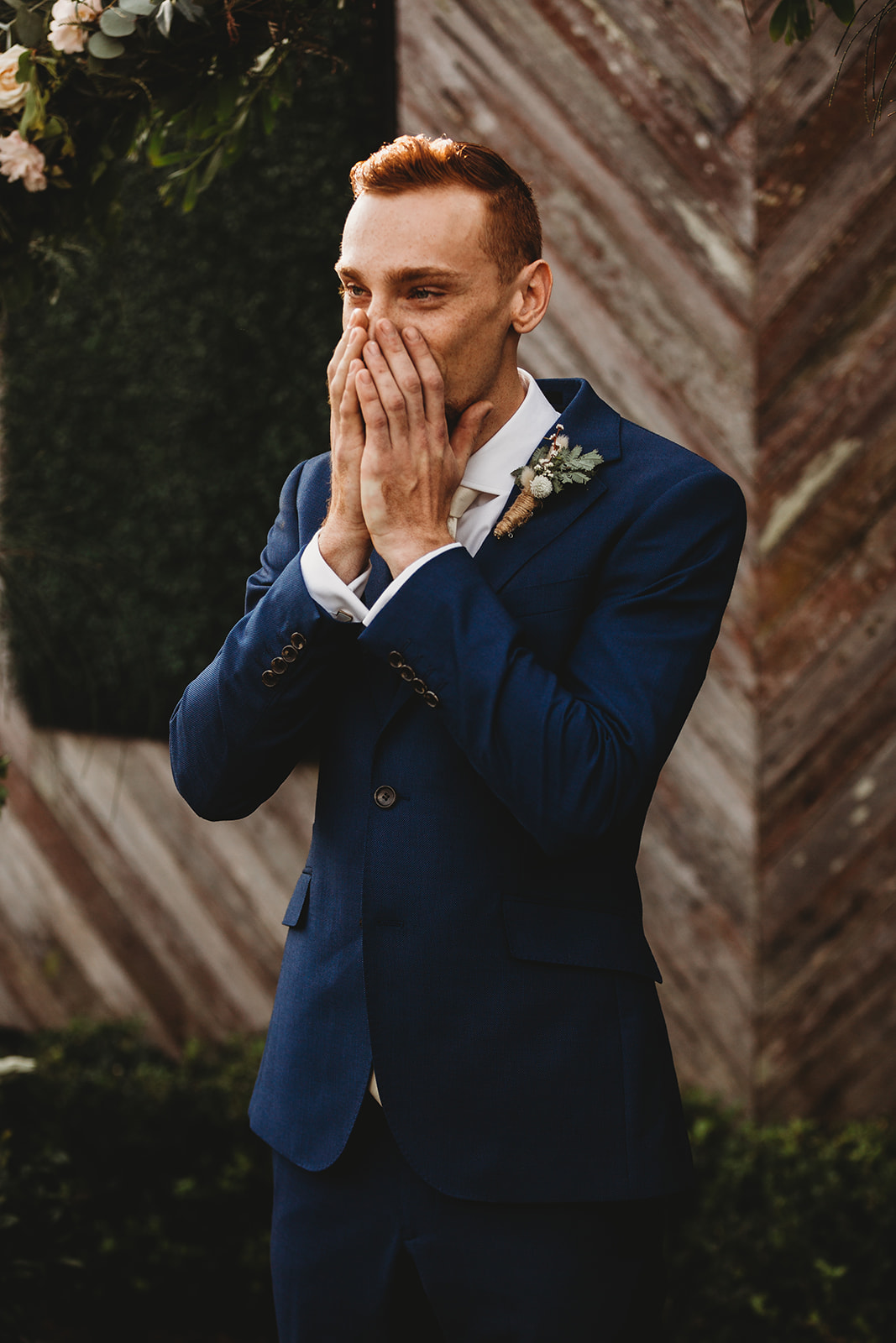 Groom covers face with hands cry during your wedding