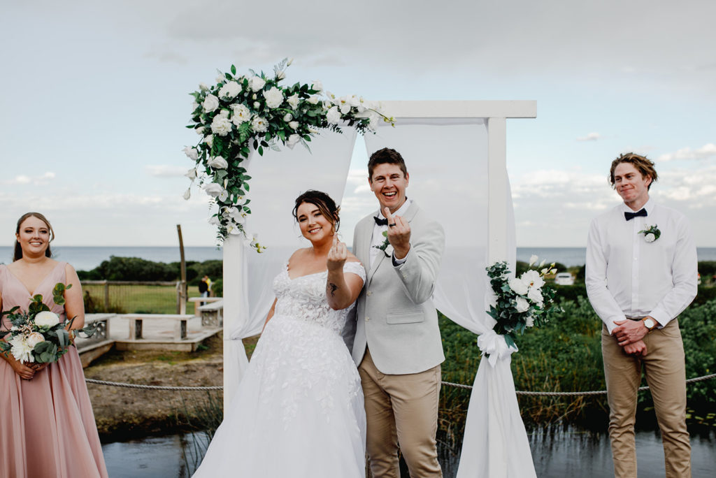Couple are Married AF at Caves Coastal Bar & Bungalows