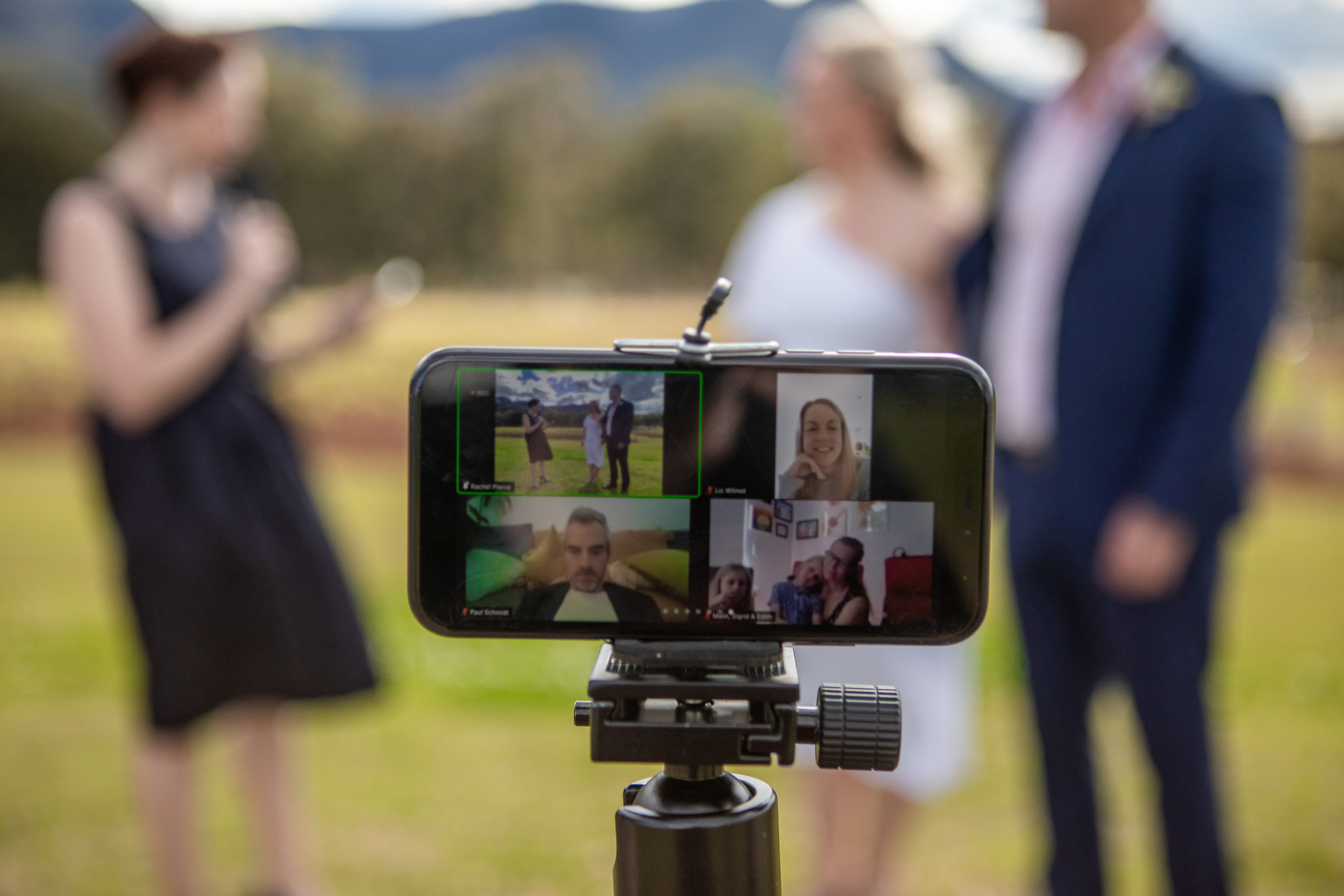 close up of phone video calling three people to attend the wedding
