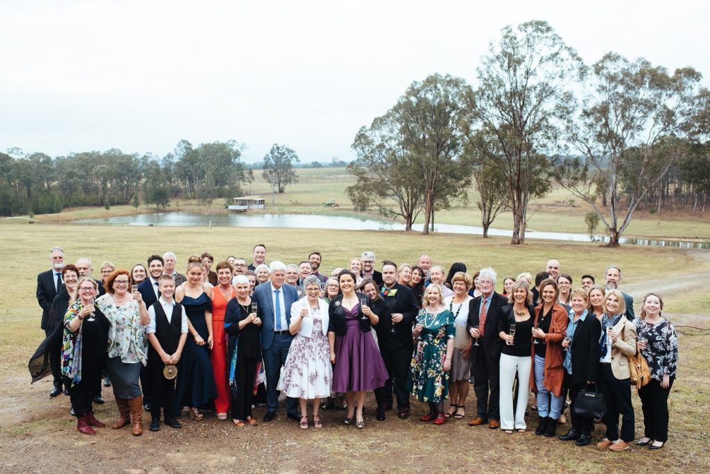 Group shot of brides and guests at Block Eight Winery wedding