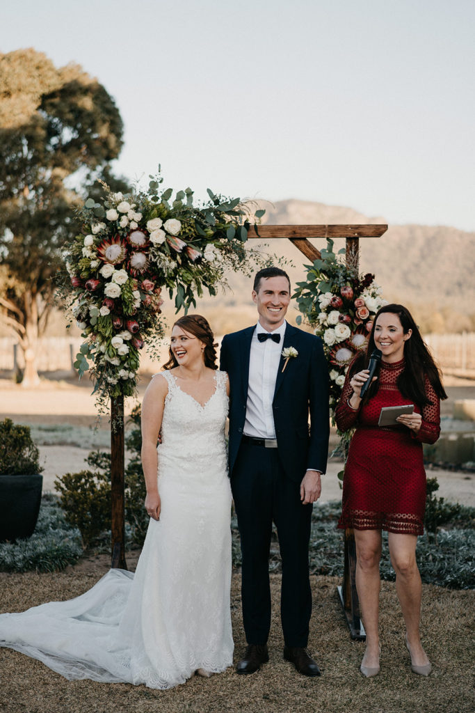 Hunter Valley Wedding Venue Margan Wines and Restaurant couple smiling and standing beside Celebrant Julie Muir