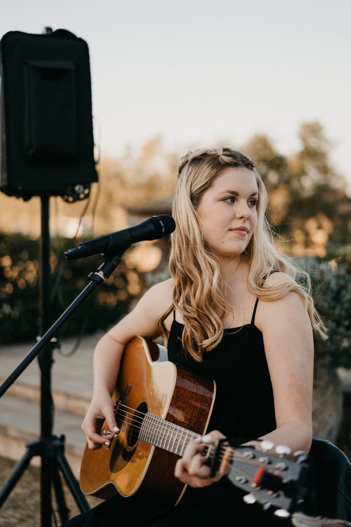Margan Winery wedding musician with her microphone and acoustic guitar