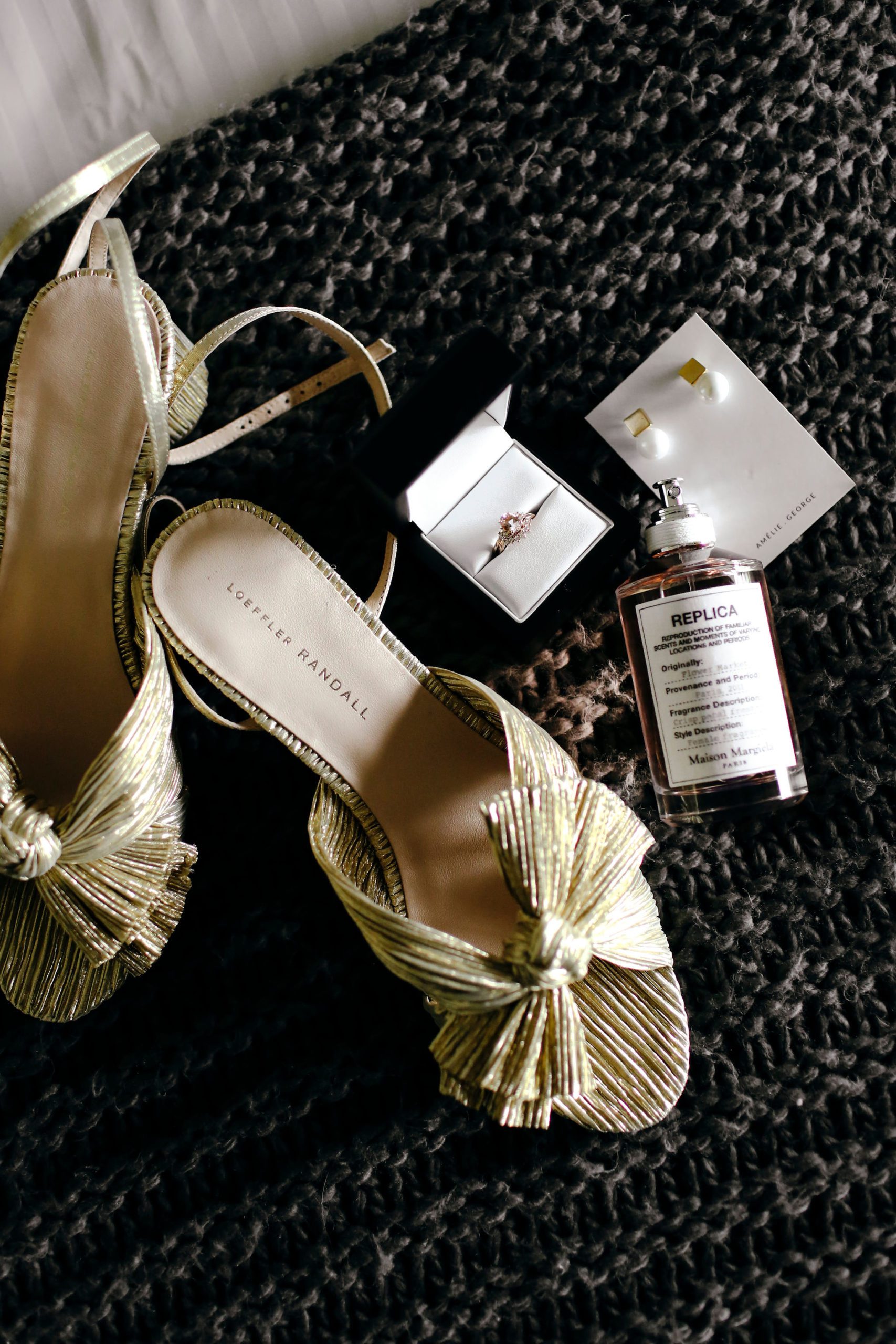 Wedding shoes, perfume and rings. 