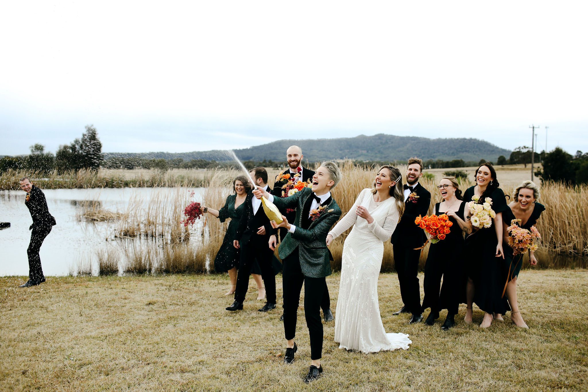 Brides spraying champagne bottle after the ceremony at Adam's Peak.