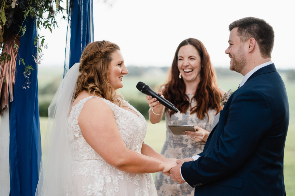 Celebrant Julie Muir making the couple laugh during their ceremony at Wallalong House