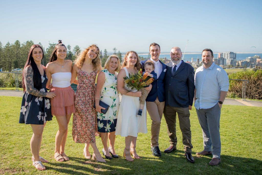 Group photo of newlyweds and their wedding guests at their Shepherds Hill wedding