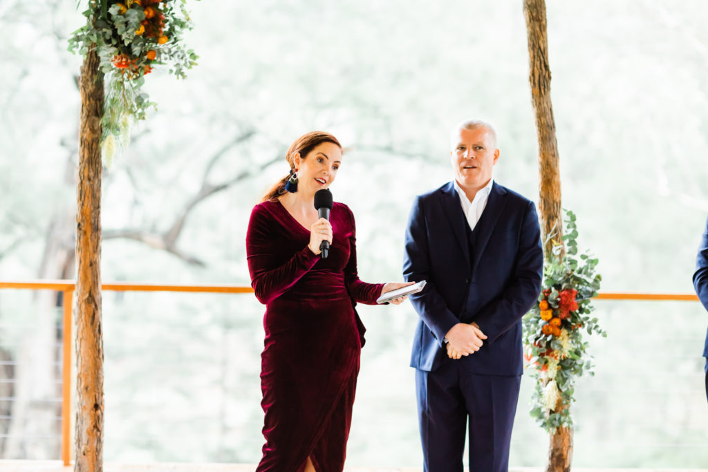 Celebrant Julie Muir talking mid-ceremony beside groom at a Hunter Valley Wedding Venue in Stonehurst Cedar Creek