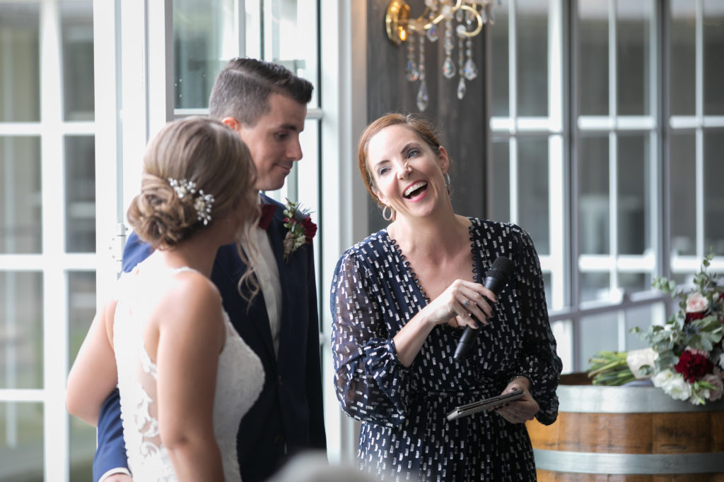 Celebrant Julie Muir laughing with groom and bride at Leogate Estate wedding