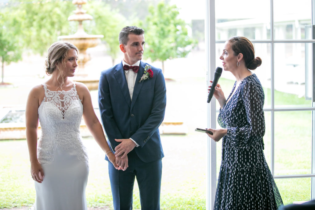 Celebrant Julie Muir talking to bride and groom mid-ceremony at Leogate Estate wedding