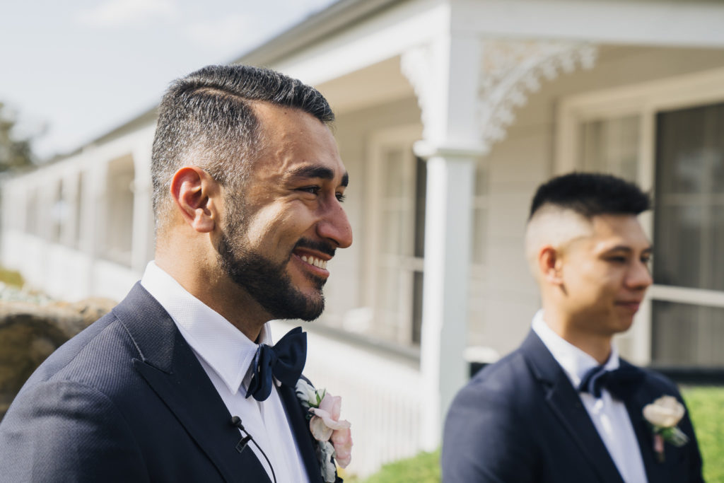 Close up of groom smiling at Voco Kirkton Park wedding