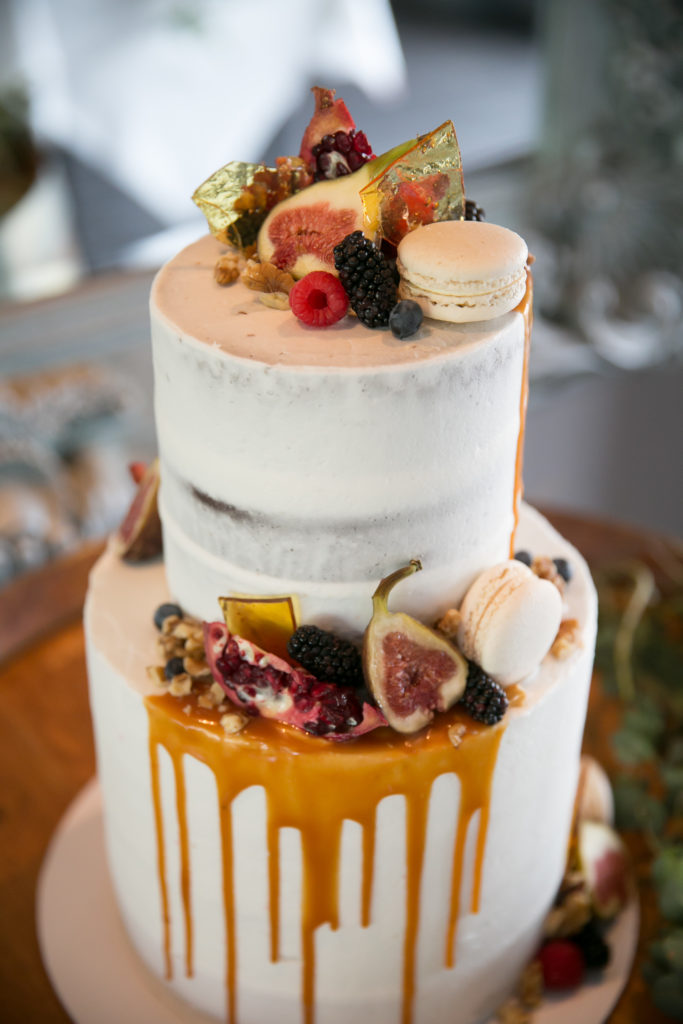 Beautiful two tier wedding cake with fresh figs on top