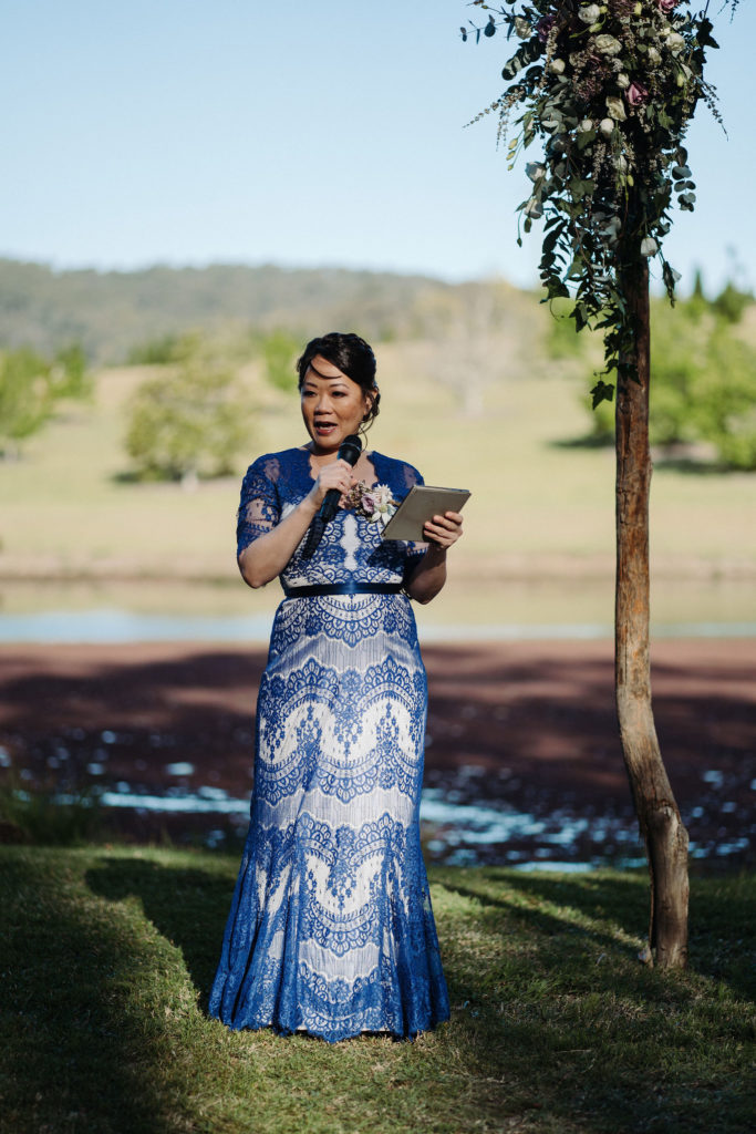 Guest in blue dress doing a reading at The Woodhouse Wollombi