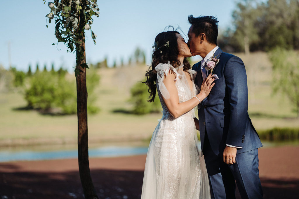 Bride and groom sharing a kiss at The Woodhouse Wollombi wedding
