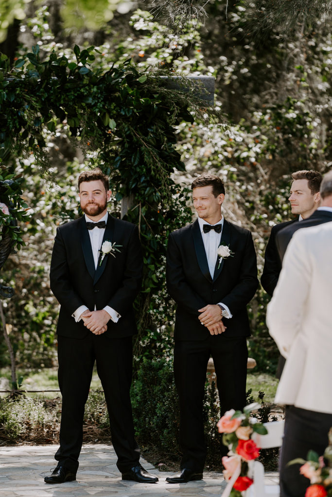 Groom and groomsmen waiting for bride to walk down the aisle at Circa 1876 
