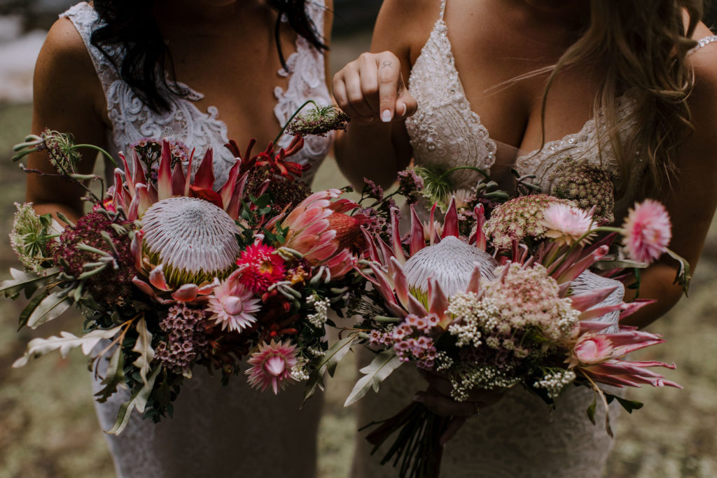 Close up shot of brides holding their bouquets