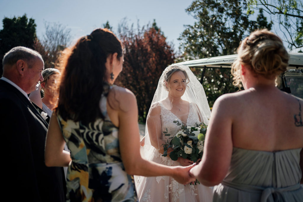 Celebrant Julie Muir giving the bride some last minute words of wisdom before walking down the aisle at Hunter Valley Gardens