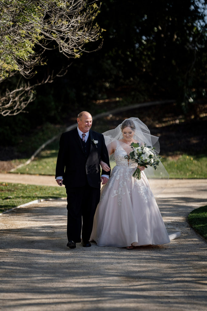 Hunter Valley Gardens wedding bride and bride's father walking down the aisle