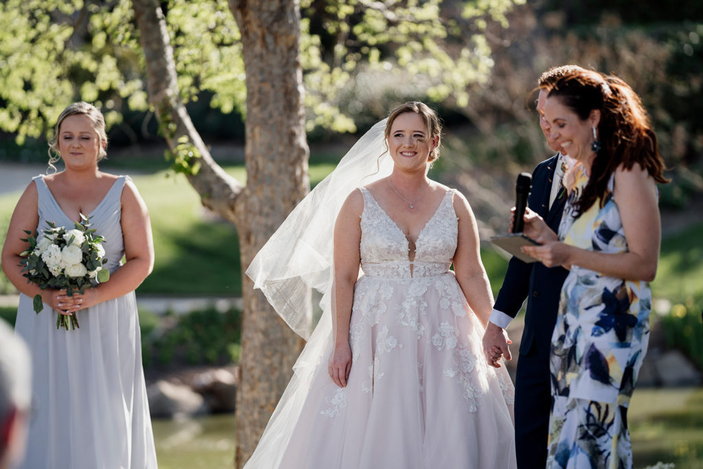Couple and celebrant Julie Muir smiling at Hunter Valley Gardens wedding