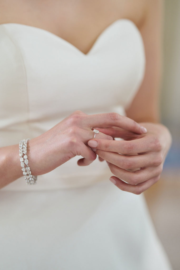 Close up of bride touching her wedding ring