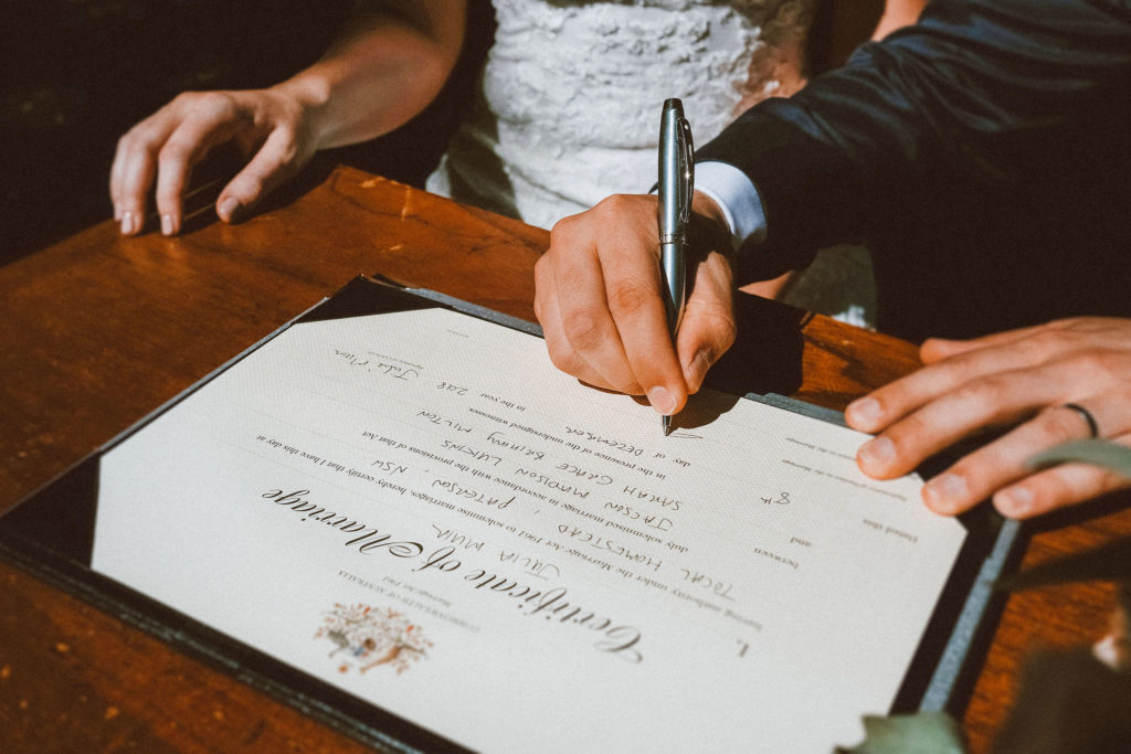 Signing the paperwork after the wedding at Tocal Homestead.