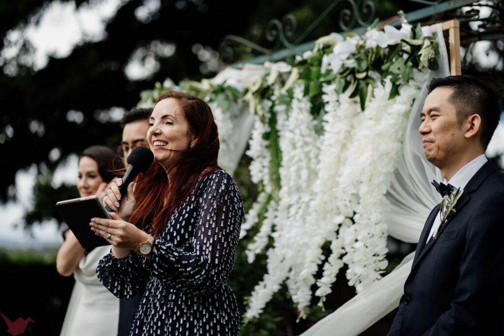 Celebrant Julie Muir laughing during wedding ceremony at Anambah House