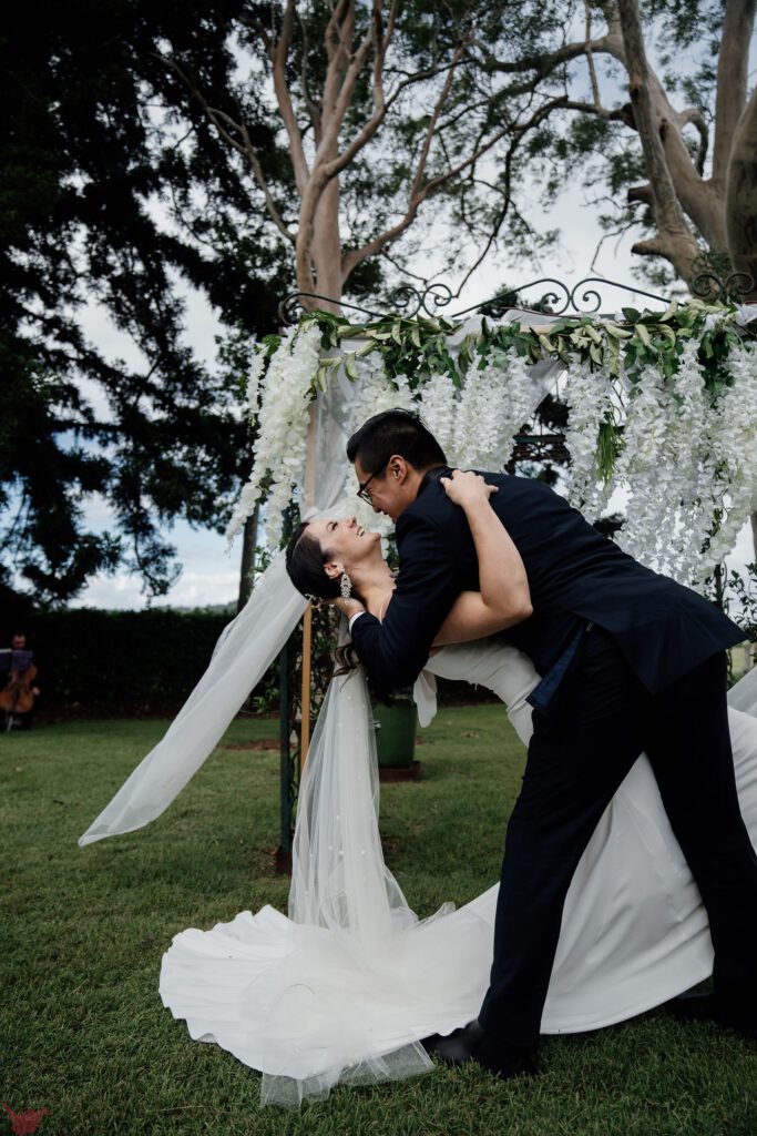 Romantic dip kiss mid ceremony