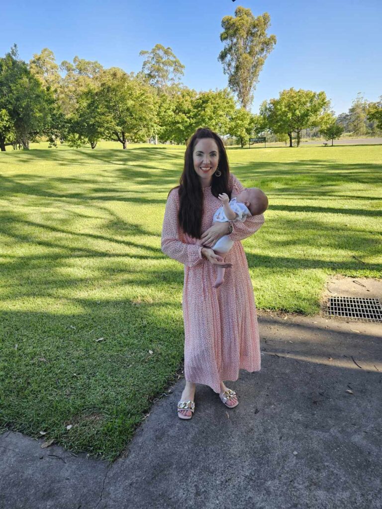 Celebrant Julie Muir holding baby at Hunter Valley Baby Naming Ceremony