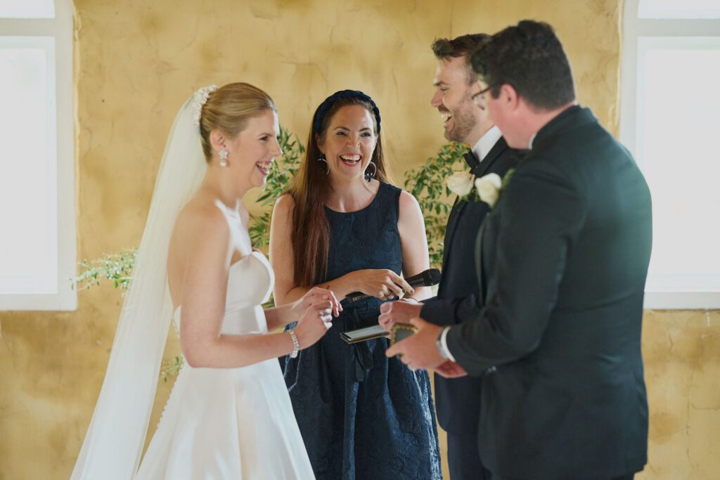 Hunter Valley Wedding Venue Peppers Creek Chapel Celebrant Julie Muir laughing with bride and groom and best man