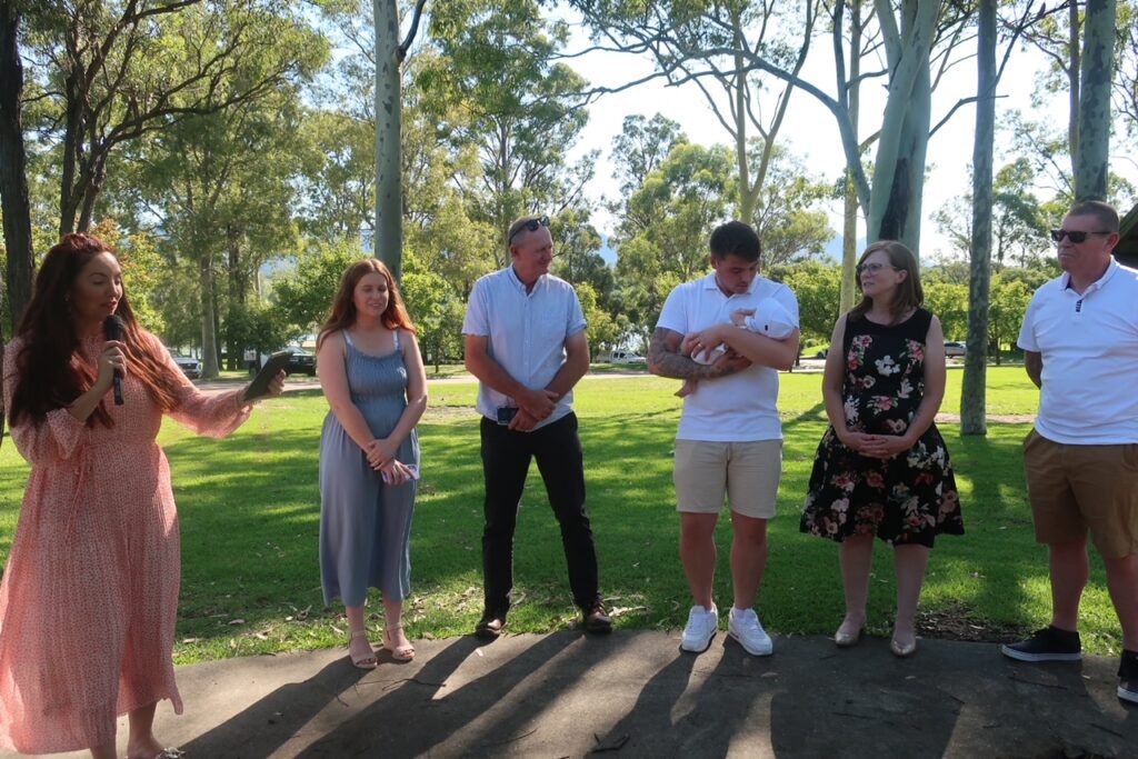 Celebrant Julie Muir standing with parents and grnadparents during Hunter Valley Baby Naming ceremony