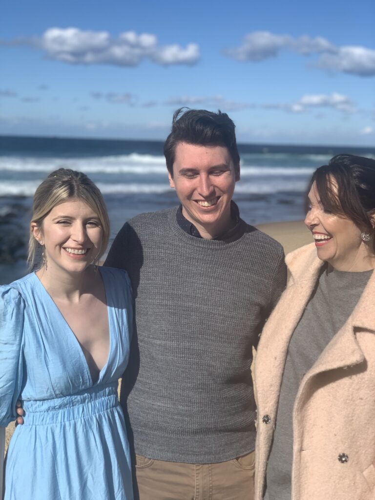 Celebrant Julie Muir laughing with newlyweds during Merewether legals only wedding