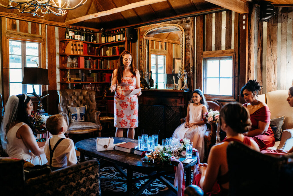 Celebrant Julie Muir talking to bridal party in the study at Circa 1876 wedding venue pre-ceremony