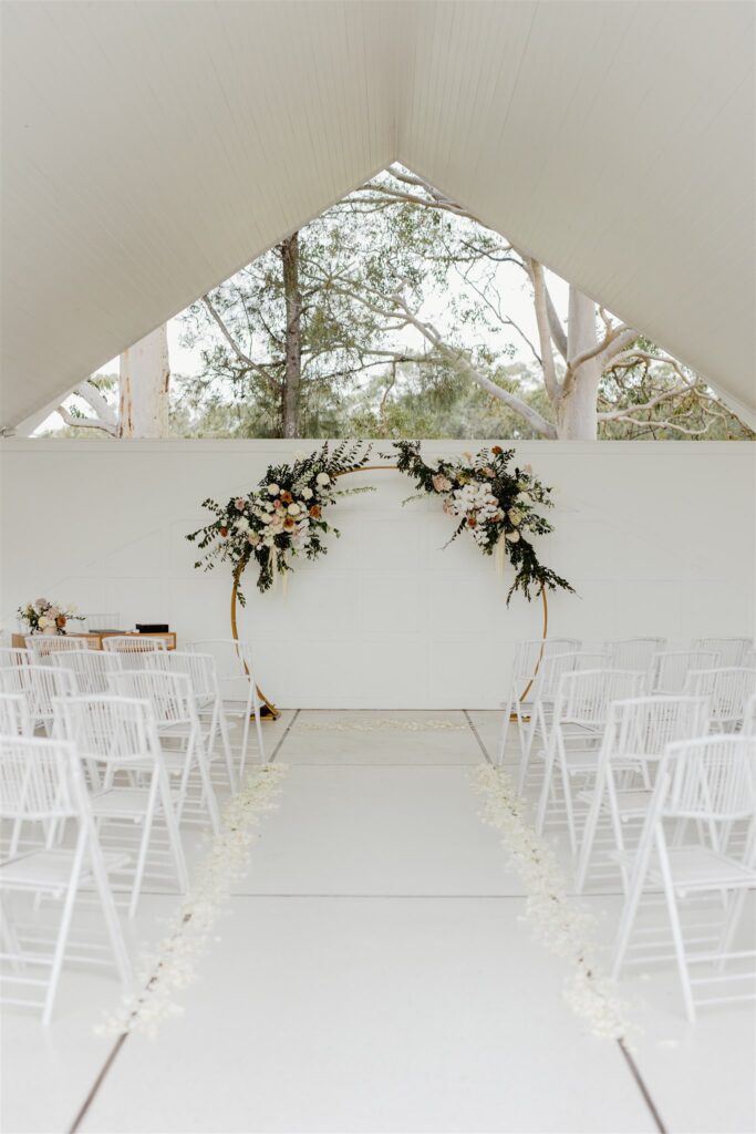 Greystone estate wedding venue showing foldable chairs and arbour
