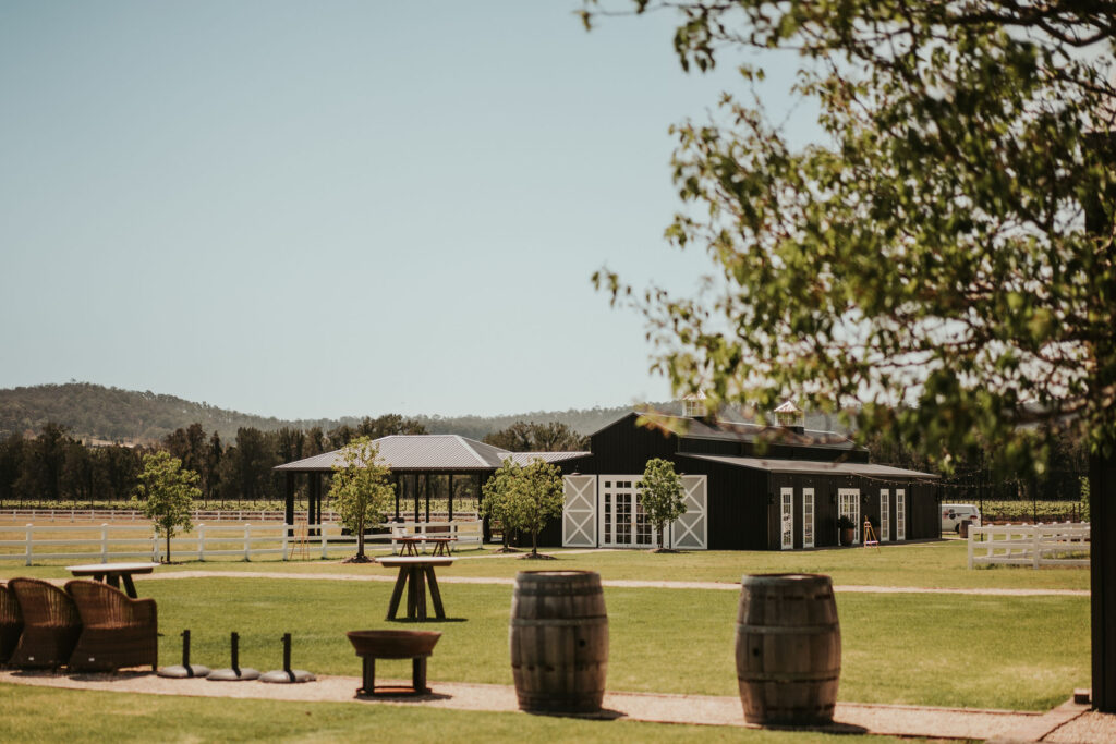 Wide shot of the Dark Horse Vineyard showing their manicured lawn and their modern black barn