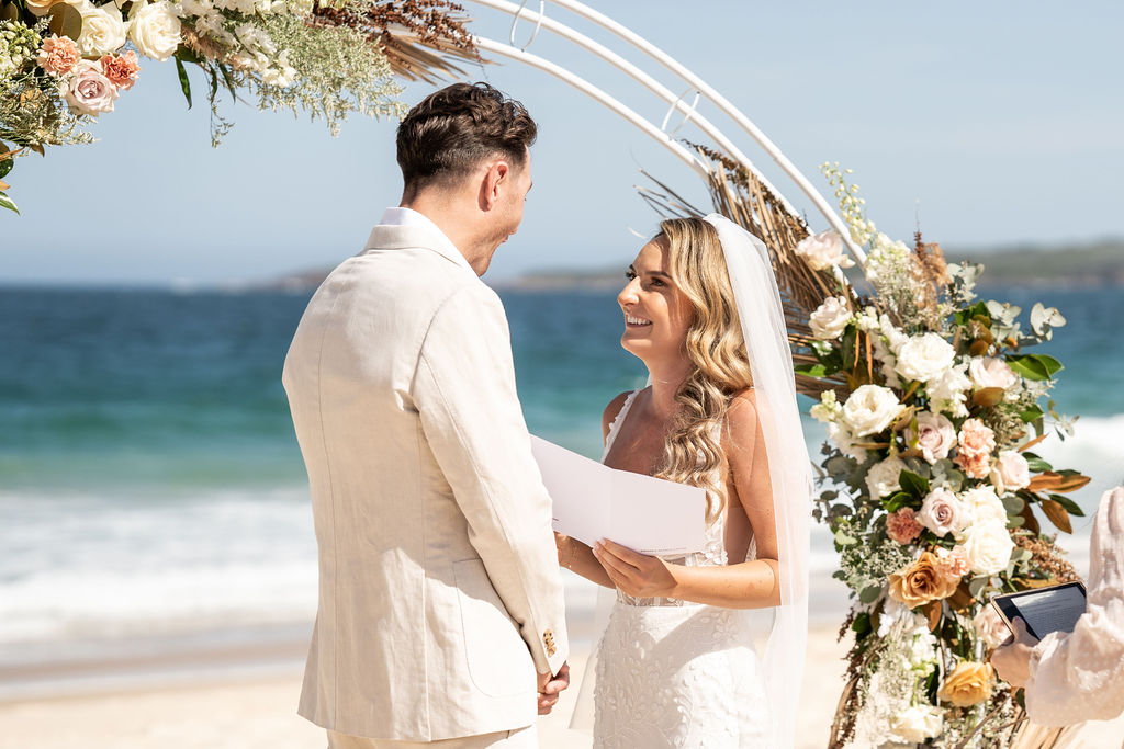 Bride reading her vows to her groom at Zenith Beach