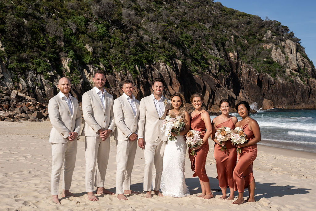 Bride and groom with their groomsmen and bridesmaids at Zenith Beach