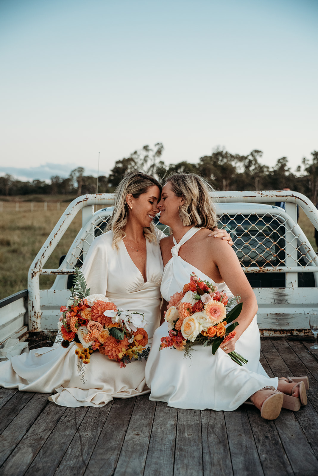 Two brides on the back of a ute at Great Hops Brewery
