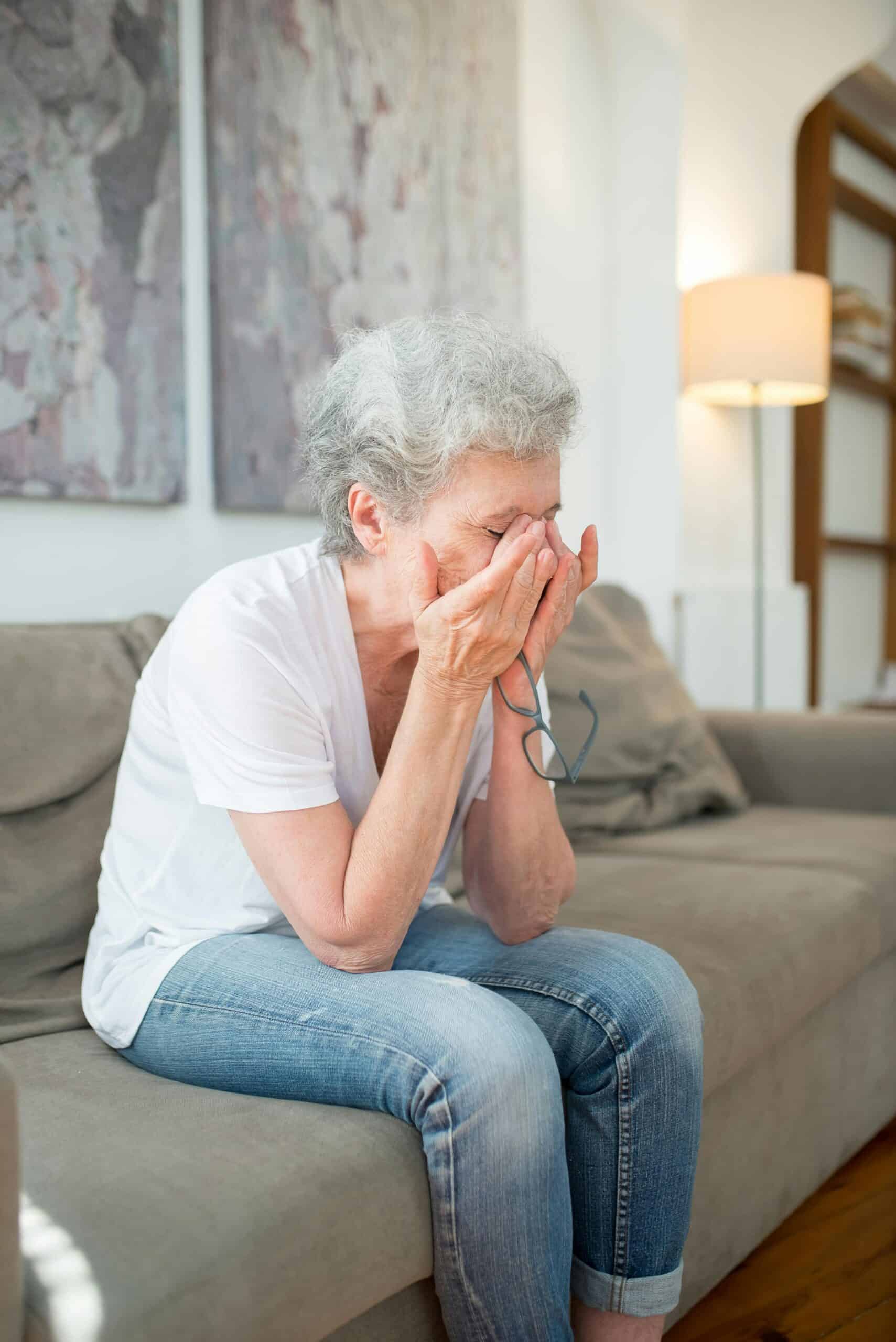 woman watching a movie while grieving