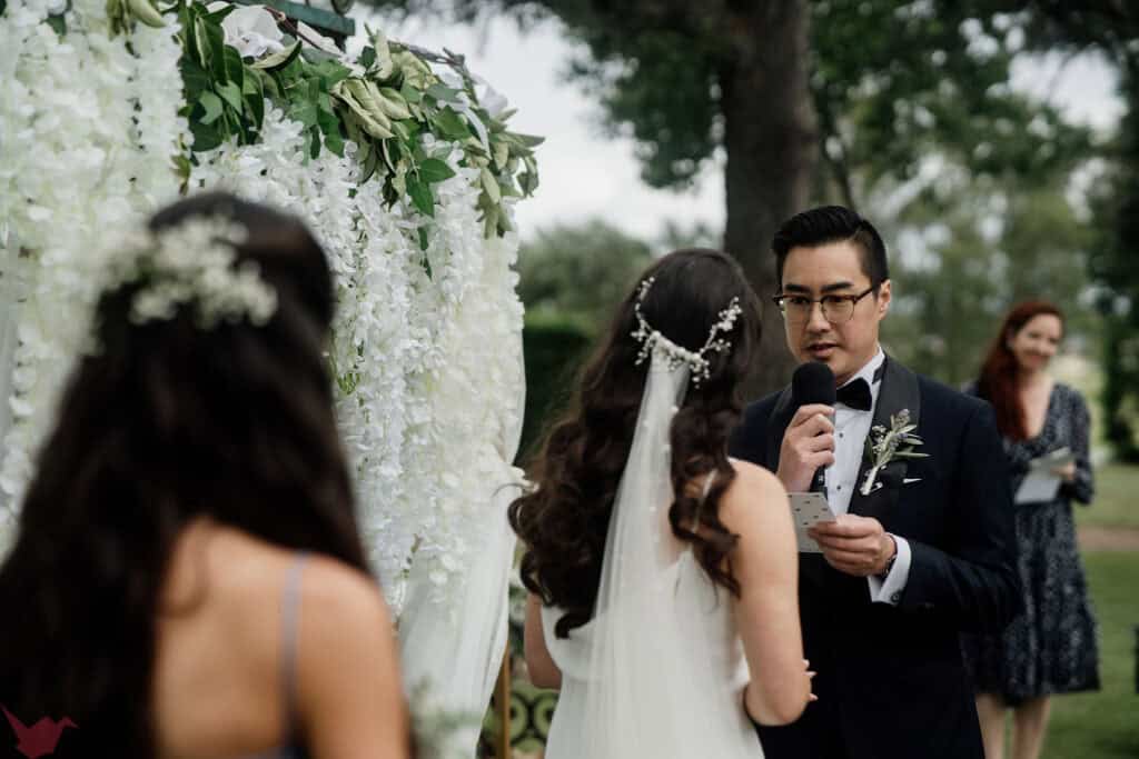 Groom saying his vows during wedding ceremony at Anambah House