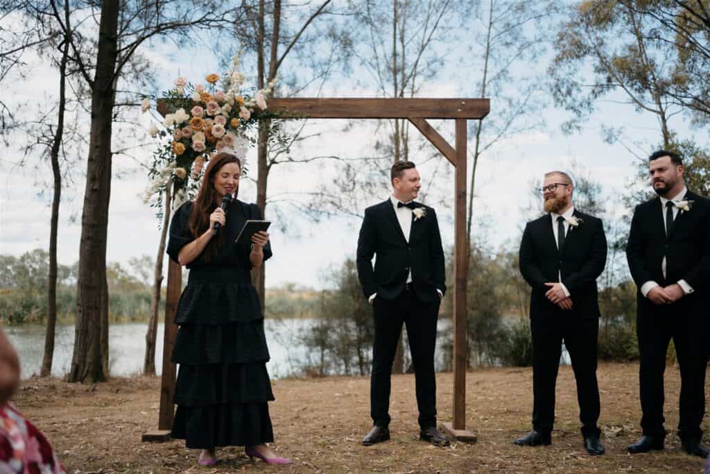 Groom stands waiting for bride at The Wine House