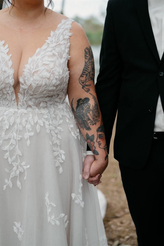 The Wine House wedding couple holding hands