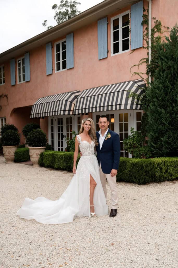 Stunning couple in front of the Tuscan inspired house at Redleaf Wollombi