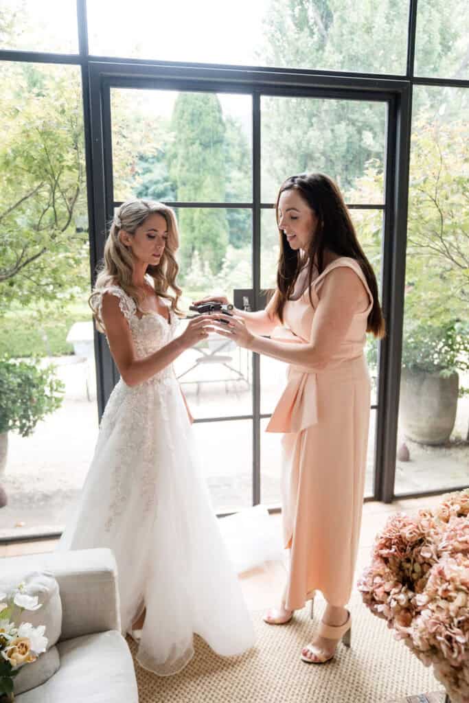 Bride and Celebrant doing whiskey shot at Redleaf Wollombi