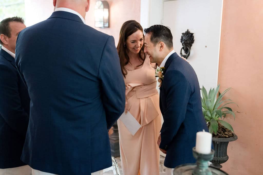 Celebrant Laughing with the groom before the ceremony at Redleaf Wollombi