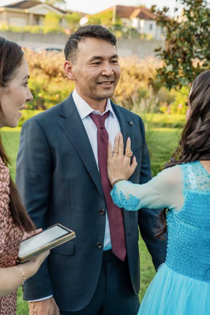 Bride places hand on grooms chest during Jesmond Park wedding