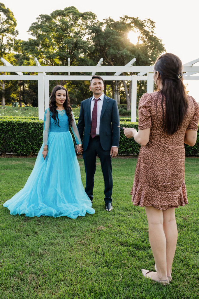 Celebrant Julie Muir stands facing the couple at Jesmond Park wedding