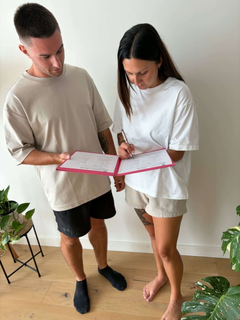 hamilton-wedding-bride-and-groom-signing-wedding-contracts