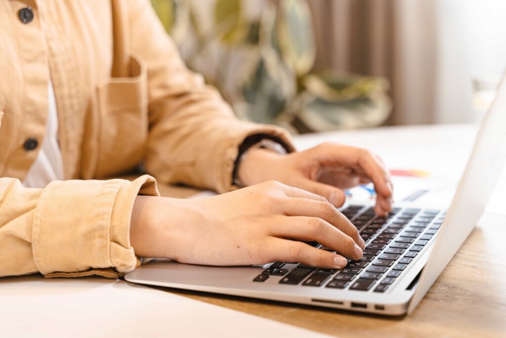 person-working-on-admin-after-death-using-their-laptop